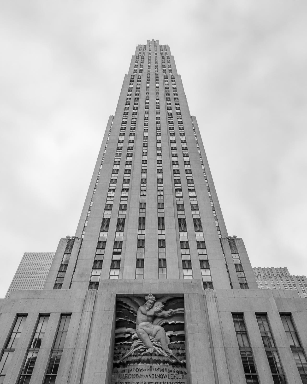 Monumental stone tower facade seen from below